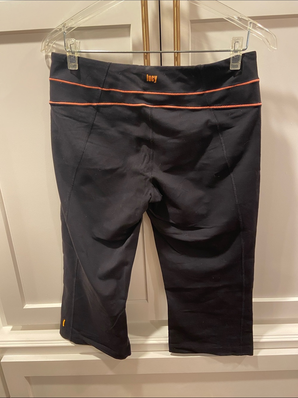 Lucy Black Capri Leggings with Orange Piping and Logo